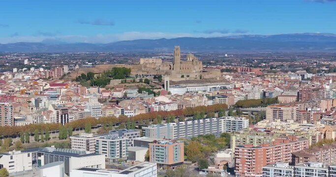 Drone pan over the historic city of Lleida in Spain in sunshine