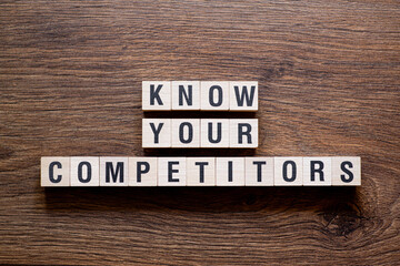 Know your competitors - word concept on building blocks, text