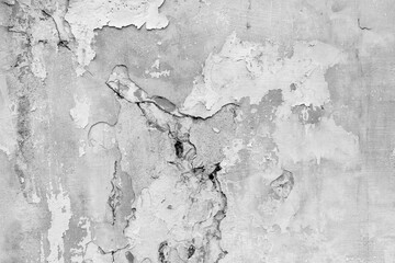 Old wall with deep cracks. Grunge gray color texture. Destruction on the surface of the wall.