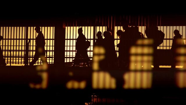 Many passengers going to vapor or airport in front of sunset