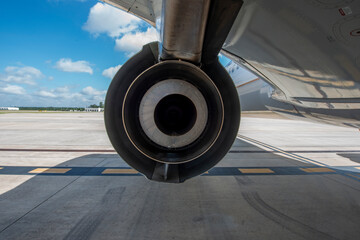 close up of passenger aircraft wheel on tarmac runway