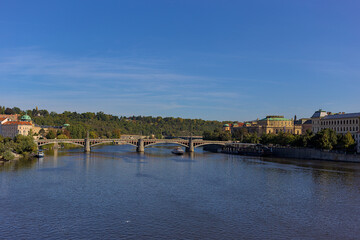 Manes Bridge, Manesuv Most, across Vltava River, Prague, Czech Republic. Picturesque city landscape. Popular tourist attraction.