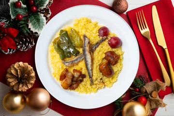 Migas with chorizo. Traditional spanish tapa from Andalucia. Christmas food serverd in an elegant table.