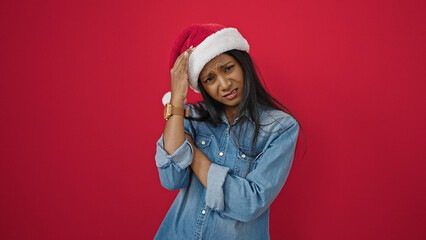 African american woman standing looking upset over isolated red background