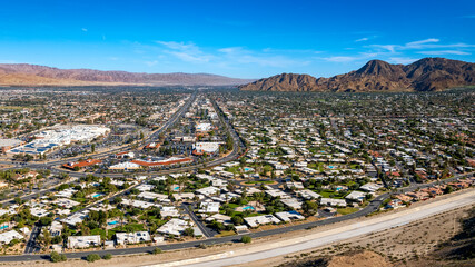 Aerial panoramic view of Palm Desert resort communities and mountains