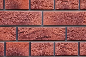 perfectly smooth brickwork with straight seams. plane brick wall orange-brown. 