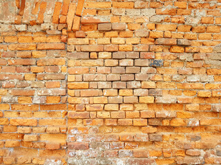 Damaged red brick wall texture background.