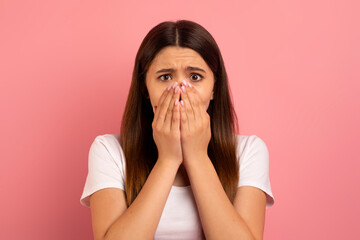 Oh No. Portrait Of Shocked Teen Girl Covering Mouth With Hands