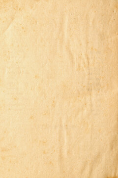 Old paper manuscript with yellowed texture from old age as background