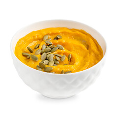Portion of homemade healthy vegetarian pumpkin cream soup made of pureed vegetables and squash decorated with dried seeds or pepita served in bowl isolated on white background for lunch or dinner