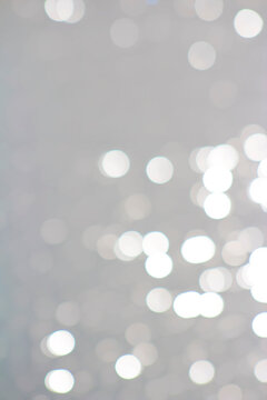 White & Pearlescent Sparkly Bokeh Like Look Water Background or Border (filtered photo)