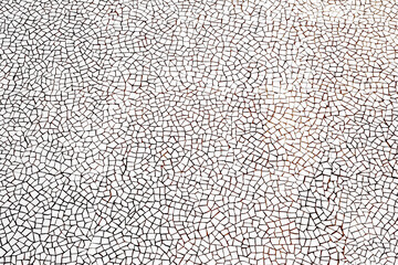 Geometric shape background. White mosaic pieces background. Ceramic decoration texture. Puzzle look graphic design. Bright cracked texture. Ceramic tile wall. Uneven porcelain pieces.