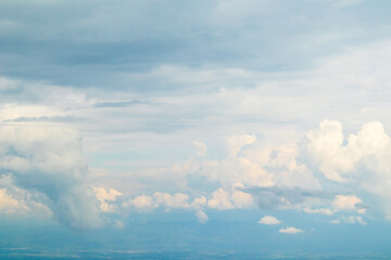 Beautiful white fluffy clouds on blue sky in rainy season.