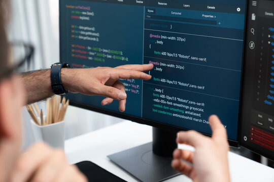 IT developers creating online software development information on screen laptop with coding program in data of application and website. Technical engineer coder on safety program concept. Sellable.