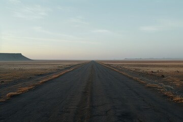 Fototapeta na wymiar A dirt road winding through the vast desert landscape. Perfect for travel or adventure themes.