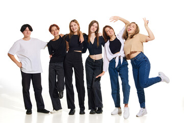 Obraz premium Group of young attractive beautiful people, women standing against on white studio background. Concept of beauty, youth, emotions, fashion, style, modelling. Copy space for ad, text.