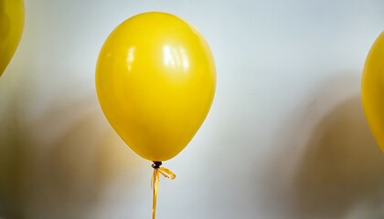 yellow balloon on a white background party decoration for celebrations and birthday