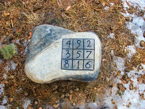 Mysterious stone found in the forest. Magic square. Luoshu magic square. Recreational mathematics. Spell supposedly allows control river and protect themselves from floods