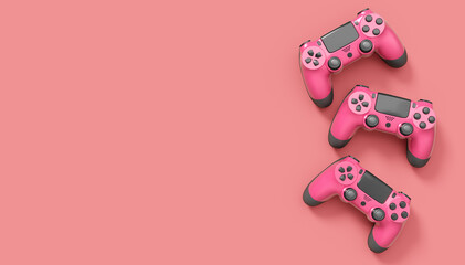 Realistic red video game joysticks or gamepads on pink background © Vasyl Onyskiv