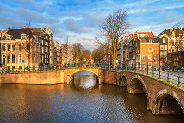 Cityscape on a sunny winter day - view of the bridges and canals in the historic center of...