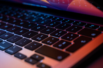 Laptop keyboard with colorful backgrounda