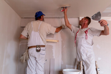 Concept Of Apartment Repair. Home renovation workers crew. Remodeling in the house (building) that...