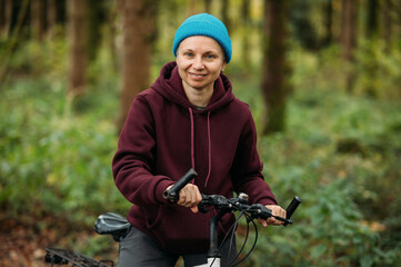 Portrait of a cyclist in the forest on a bicycle