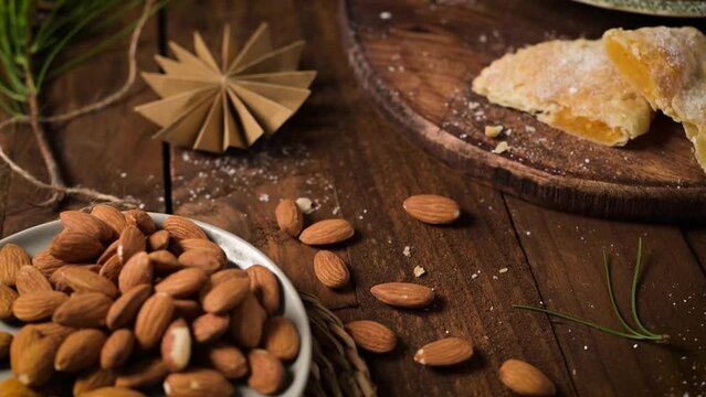 A crescent-shaped pastry whose filling is made of eggs and almonds wrapped in crispy dough, cut in an artisanal way and sprinkled with sugar.