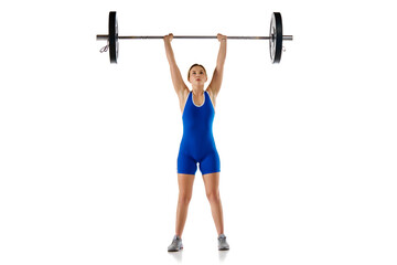 Fototapeta na wymiar Competition. Full-length of young woman in sportswear, lifting heavy barbell against white background. Concept of sport, strength, gym, healthy lifestyle, power and endurance, weightlifting.