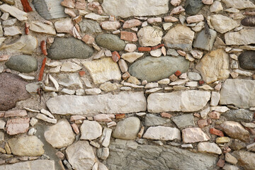 The pattern of an ancient Italian wall.