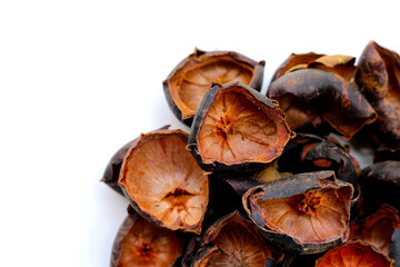 Dried mangosteen peels on white background.