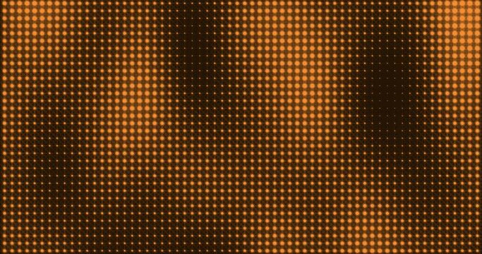 Abstract glowing orange color halftone motion background. Moving dots seamless loop. Abstract animated dot texture background.