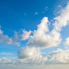 cumulus clouds on a blue sky.