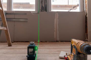 Concept Of Apartment Repair. Use of lasers in construction. Remodeling in the house (building) that...