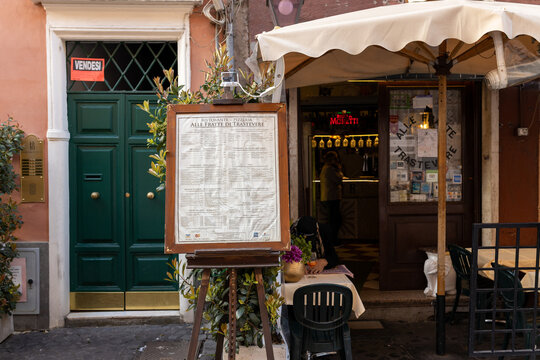Rome, Italy, April 05, 2022 - Outdoor restaurant menu sign. Restaurant menu in front of the restaurant. Old town, morning