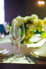 Two empty wine glasses on the festive table. Selective focus. 