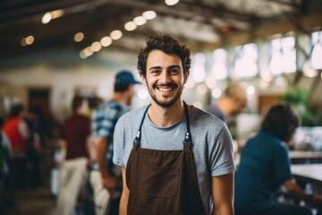 Portrait of a smiling young man working as a volunteer