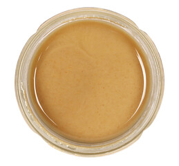 Sesame butter, paste tahini in glass jar isolated on white, top view