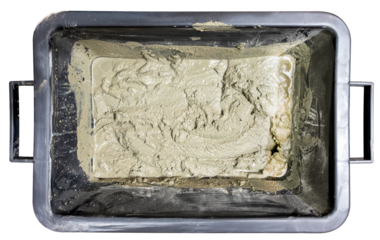 Plastic black container with mortar for bricklaying. Isolated background.