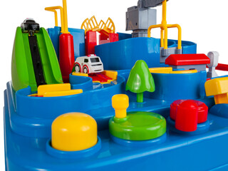 Children's toy slide with obstacles for passing cars along the road toys for kids isolated on a...