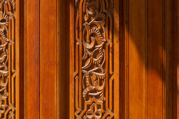 Wood carving with sacred geometric patterns. Manual labor of a woodworking master