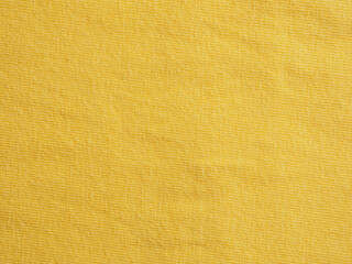 Factory textile fabric material surface yellow colored background