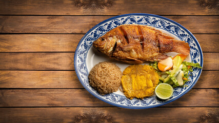 Served dish of fried tilapia fish - Typical Colombian dish