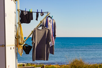 Caravan on beach with clothes to dry