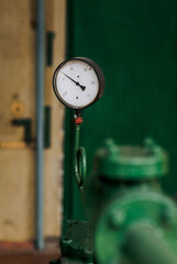 Industrial pressure gauge with a scale for measuring pressure in a pipeline. Photography, industry...