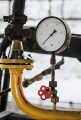 Industrial pressure gauge with a scale for measuring pressure in a gas pipeline. Close-up...