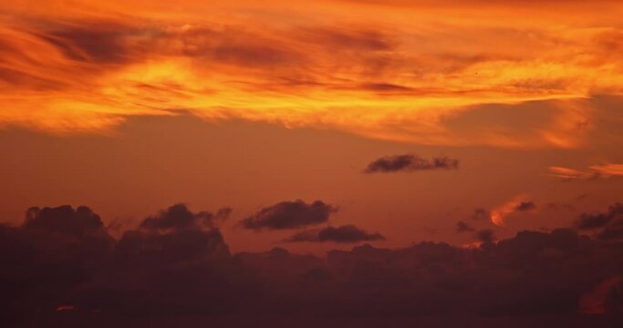 4K sunrise dawn twilight magic hour timelapse. Golden sky with vibrant clouds and orange glow. Illuminating a peaceful morning in cinematic nature daybreak