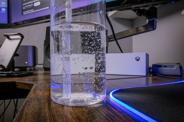 Crystal Clear Water in a Bottle with Bubbles and Condensation - Hydration Concept in a Refreshing Close-Up Shot