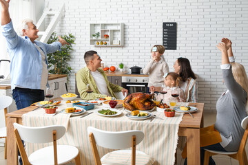 Happy family playing word guessing game at festive table on Thanksgiving Day