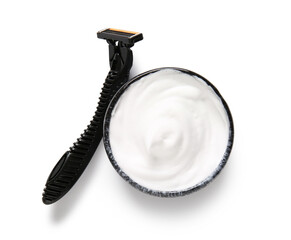 Razor and bowl of shaving foam isolated on white background